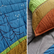 Illustration for article titled Your Kid Will Secretly Learn About Geology With this Colorful Bedding